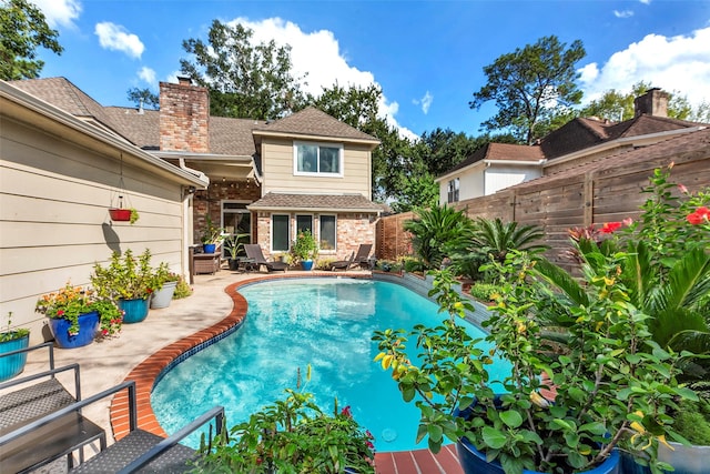 view of swimming pool featuring a patio