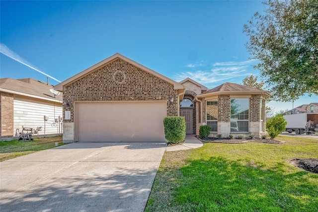 view of front facade with a front yard and a garage