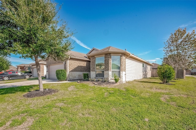 view of front of property with a front lawn and a garage