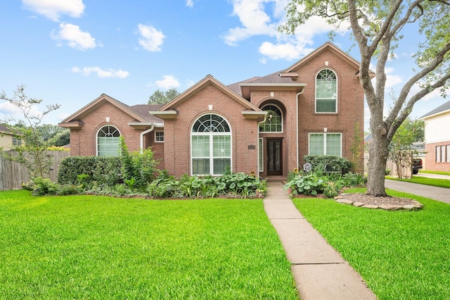 front facade with a front yard