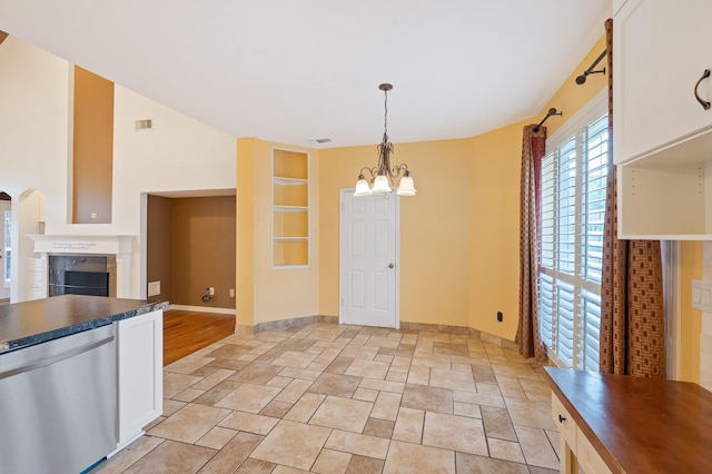 kitchen with dishwasher, a notable chandelier, white cabinets, decorative light fixtures, and built in shelves