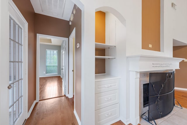 interior space with a fireplace and hardwood / wood-style floors