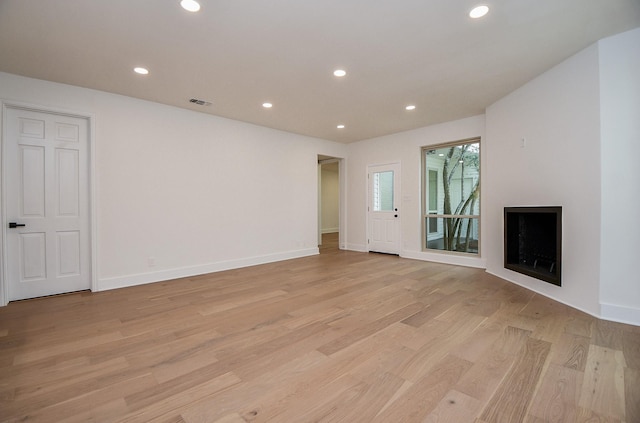 unfurnished living room featuring light hardwood / wood-style flooring