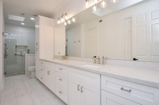 bathroom featuring toilet, an enclosed shower, and vanity