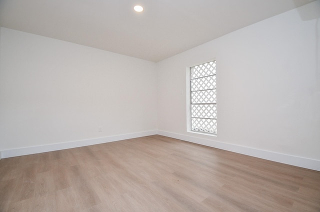 unfurnished room featuring light hardwood / wood-style floors