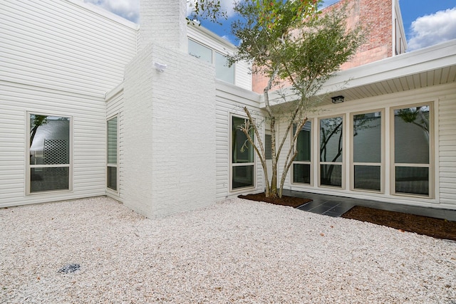 view of side of home featuring a patio area