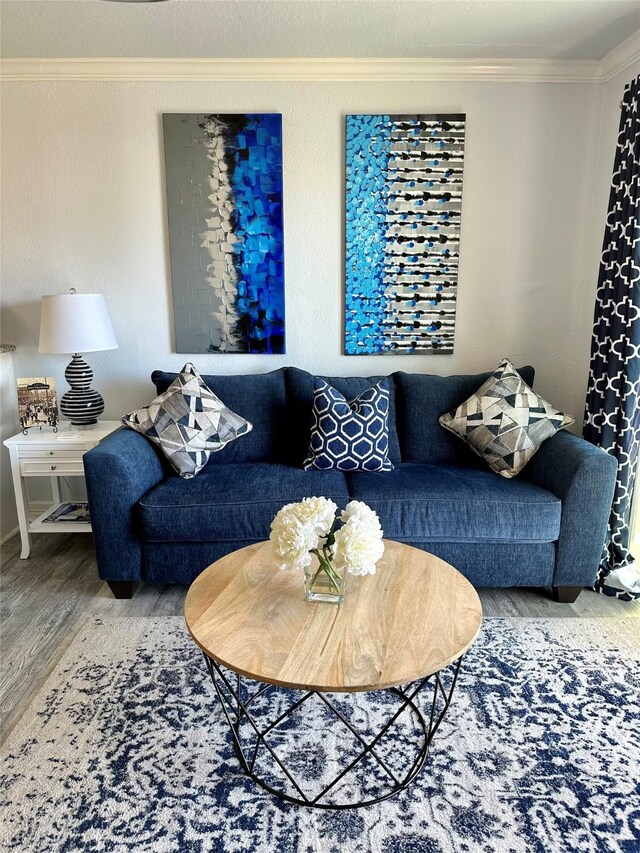 living room with ornamental molding and hardwood / wood-style floors