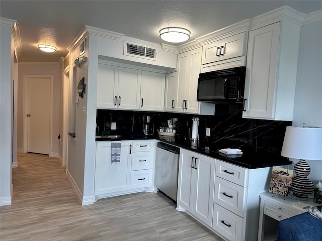 kitchen featuring white cabinets, a textured ceiling, light hardwood / wood-style floors, stainless steel dishwasher, and backsplash