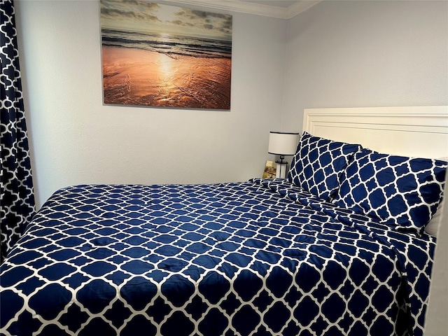 bedroom featuring ornamental molding