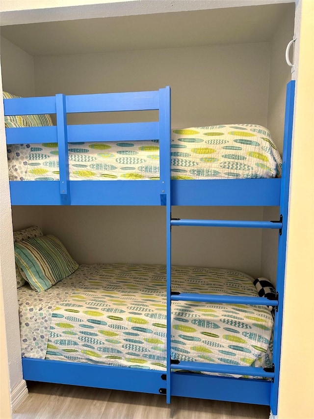 bedroom with hardwood / wood-style floors