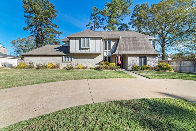 tudor-style house with a front lawn