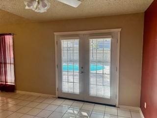 doorway to outside featuring french doors and light tile patterned flooring