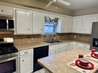 kitchen featuring sink, stainless steel appliances, white cabinets, and backsplash