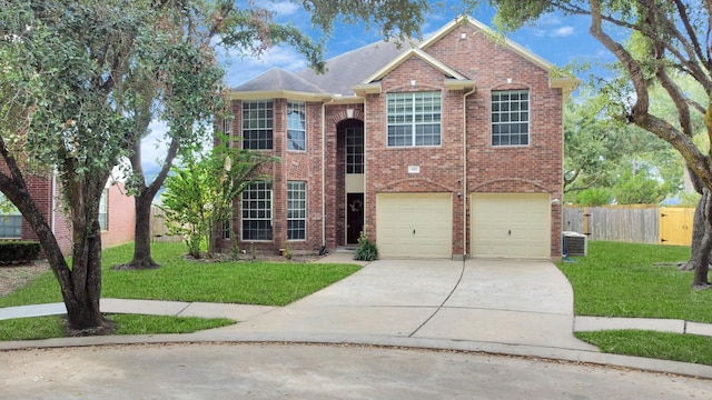 view of front of home with a garage, central air condition unit, and a front lawn