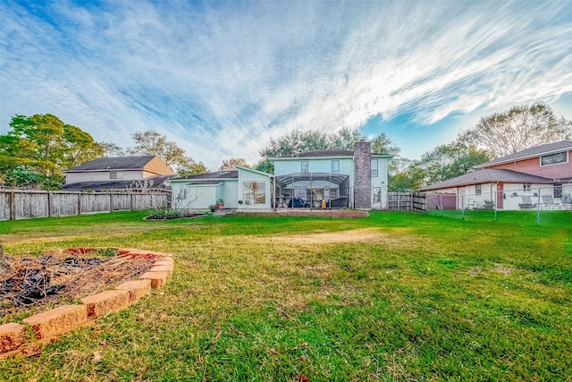 view of yard with glass enclosure