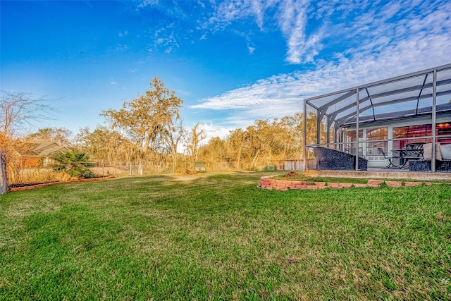 view of yard with a lanai