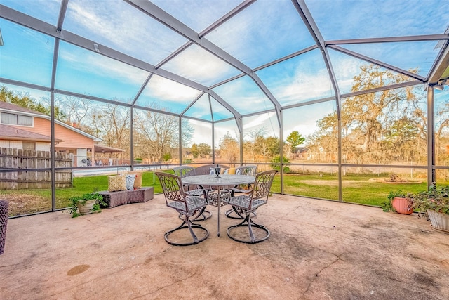 view of patio featuring a swimming pool and a lanai