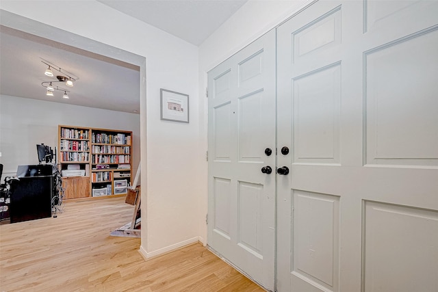 foyer entrance with hardwood / wood-style flooring