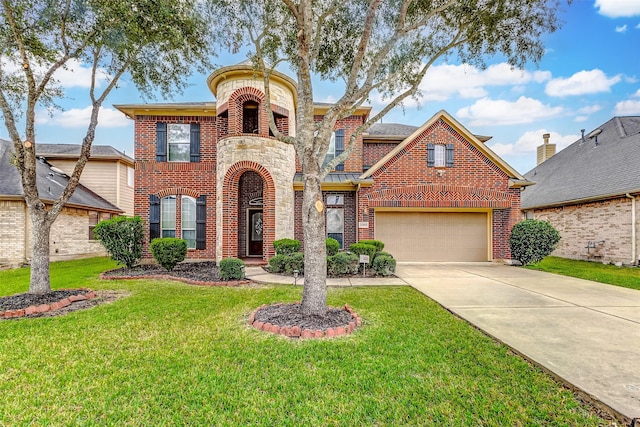 view of front of property featuring a front yard and a garage