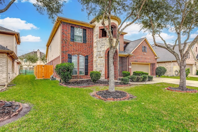 view of front of house featuring a garage and a front lawn