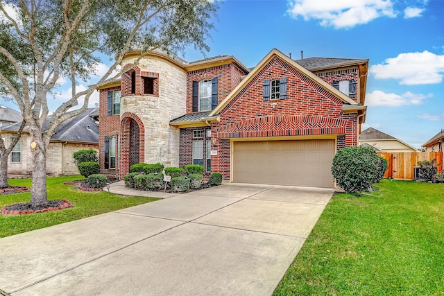 view of front of home featuring a front lawn and a garage