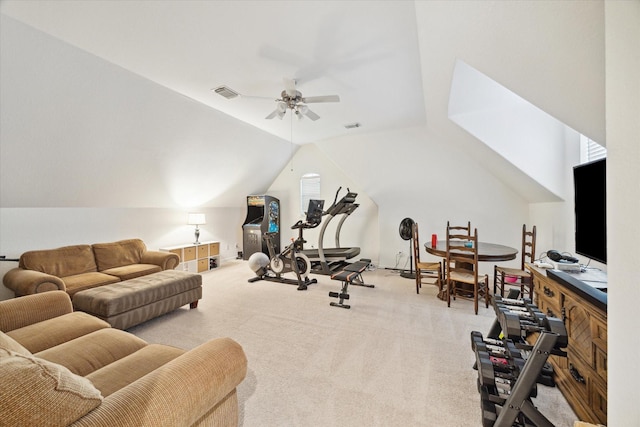 exercise area featuring lofted ceiling, light carpet, and ceiling fan