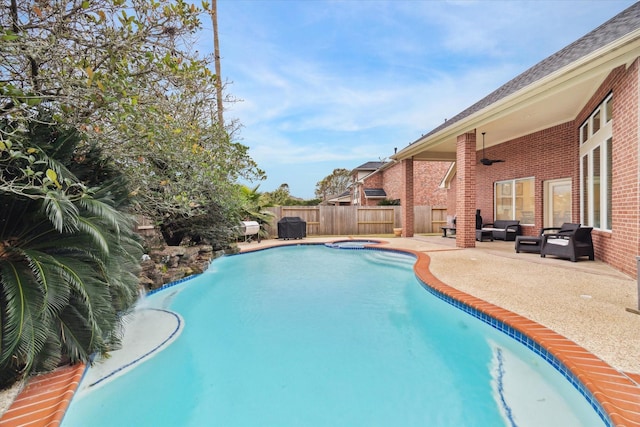 view of pool with an outdoor hangout area, an in ground hot tub, and a patio area