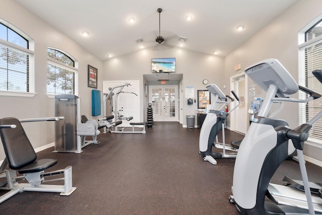 gym with french doors, ceiling fan, and vaulted ceiling