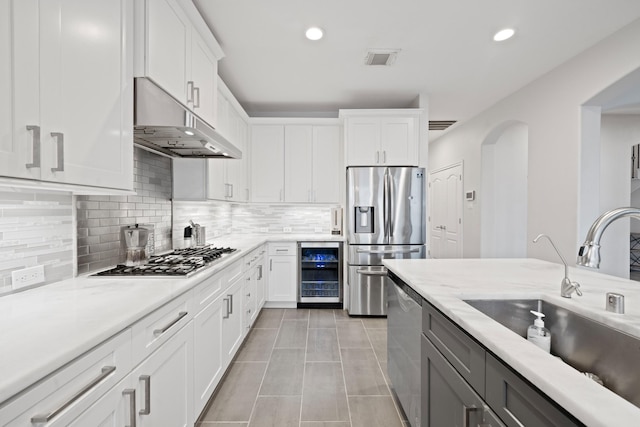 kitchen featuring white cabinets and appliances with stainless steel finishes