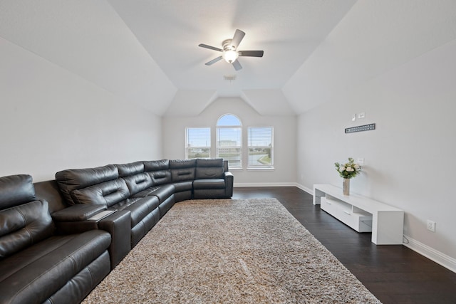 living room featuring ceiling fan, lofted ceiling, and dark hardwood / wood-style flooring