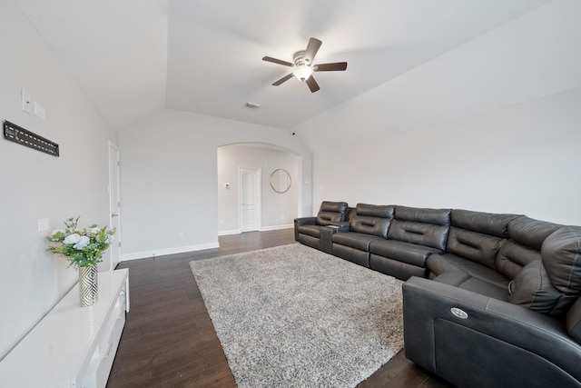 living room with dark hardwood / wood-style flooring, lofted ceiling, and ceiling fan