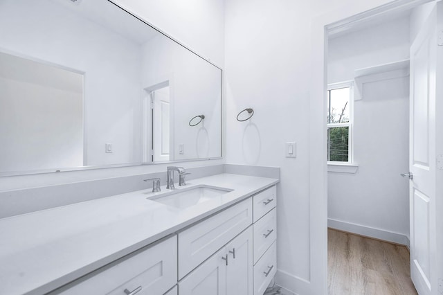 bathroom featuring hardwood / wood-style floors and vanity