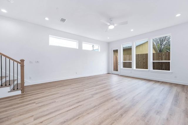 unfurnished living room with ceiling fan and light hardwood / wood-style floors