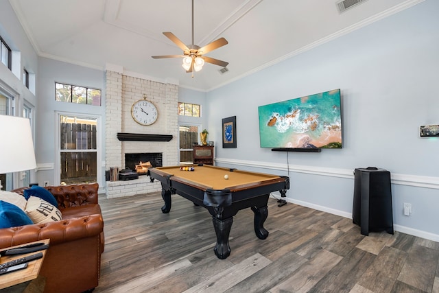 rec room with billiards, crown molding, dark hardwood / wood-style floors, and a fireplace