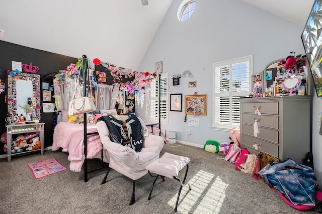 bedroom featuring high vaulted ceiling and carpet