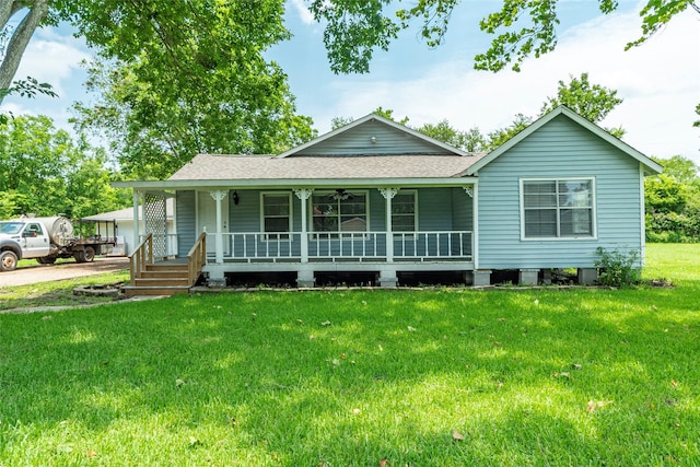 view of front facade with covered porch and a front lawn