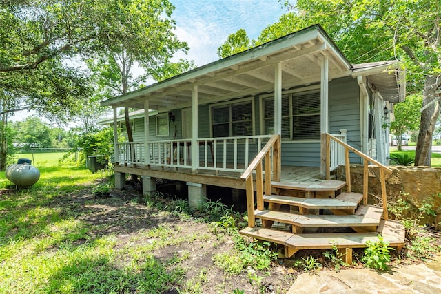 rear view of property with a porch