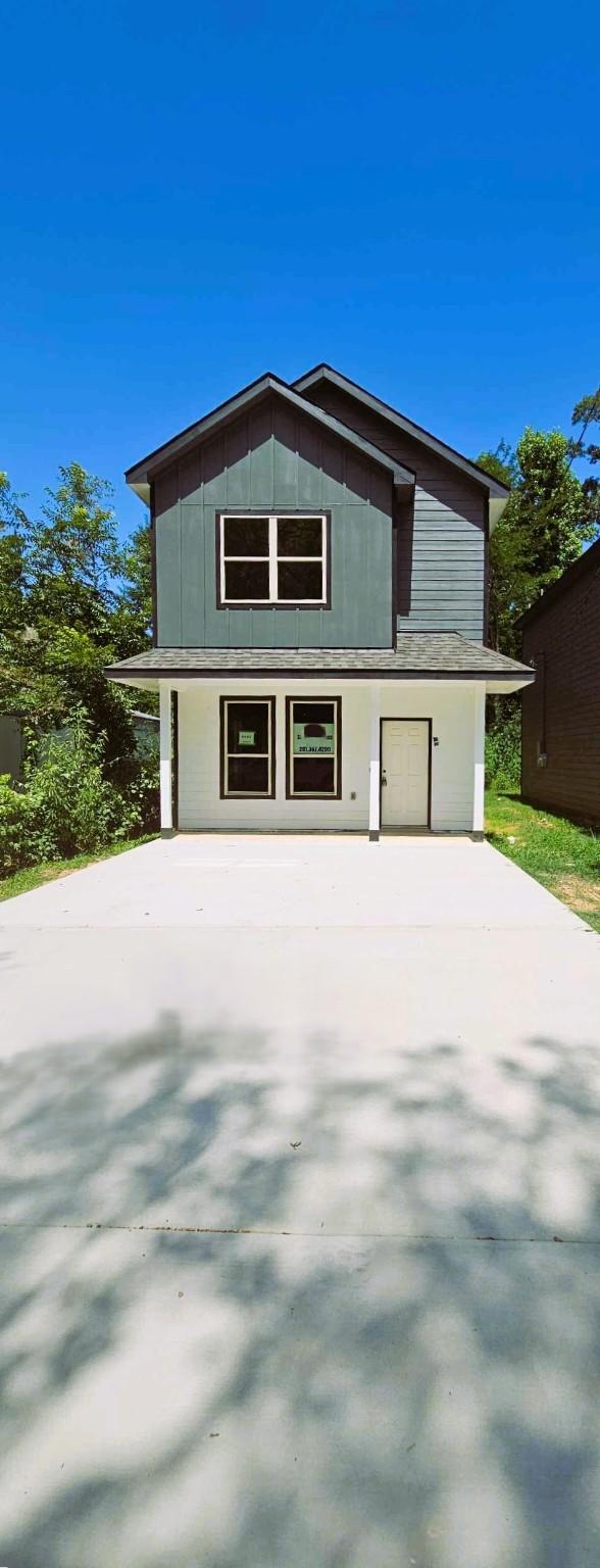 view of side of property featuring a garage