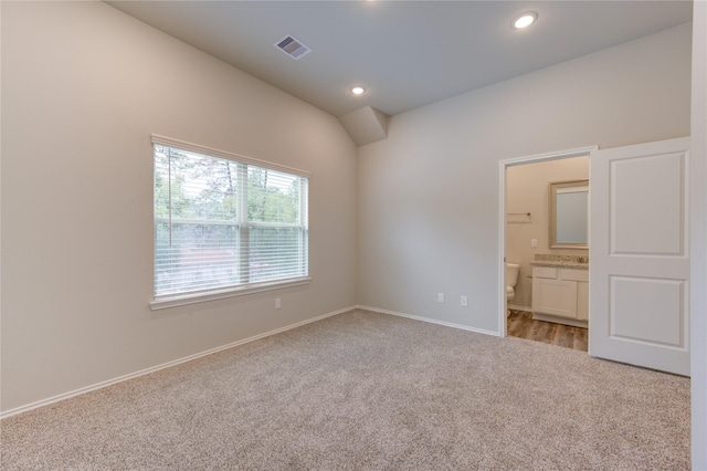 spare room with light carpet