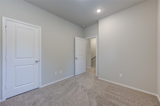 empty room featuring light carpet