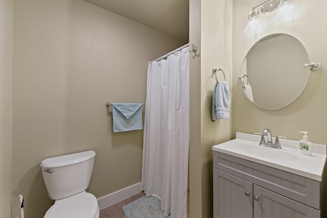 bathroom with vanity, a shower with curtain, baseboards, tile patterned flooring, and toilet