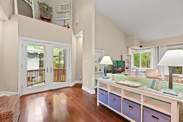 kitchen with high vaulted ceiling, blue cabinetry, dark wood-style floors, french doors, and baseboards