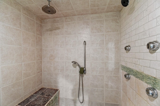 bathroom with a tile shower