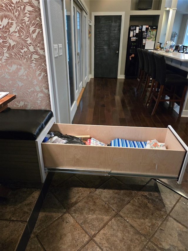 interior space featuring wood finished floors and baseboards