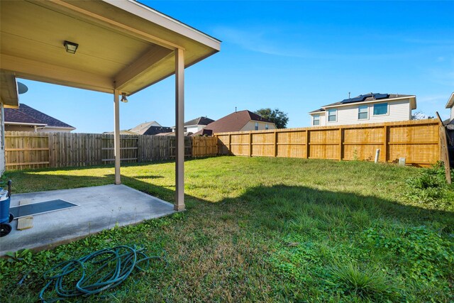 view of yard with a fenced backyard and a patio area