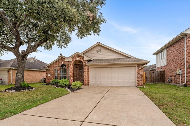 view of front of house with a front yard and a garage