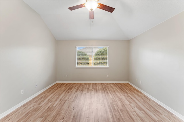 spare room with lofted ceiling, ceiling fan, and light hardwood / wood-style flooring