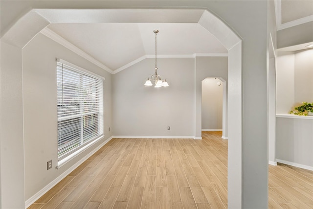 unfurnished dining area with lofted ceiling, wood-type flooring, an inviting chandelier, and crown molding