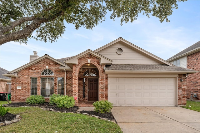 view of front of home featuring a garage and a front lawn