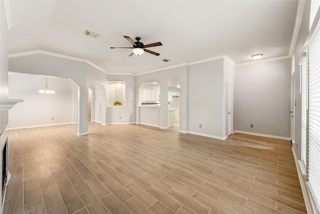 unfurnished living room featuring ceiling fan with notable chandelier, lofted ceiling, and ornamental molding